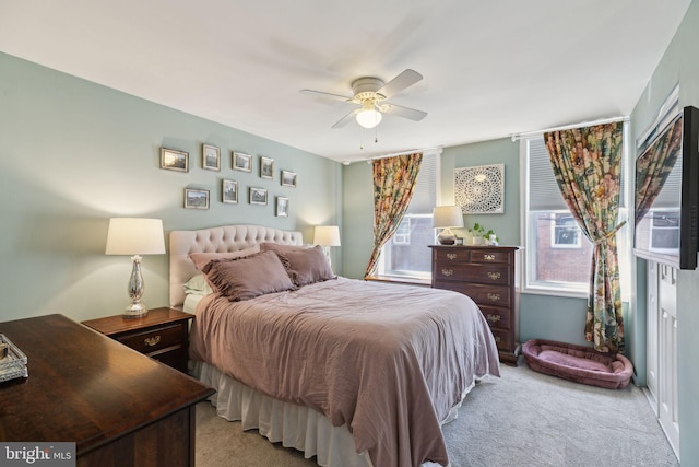 carpeted bedroom with a ceiling fan