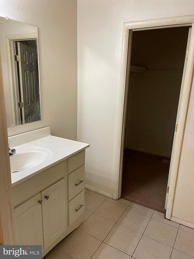 bathroom featuring vanity and tile patterned flooring