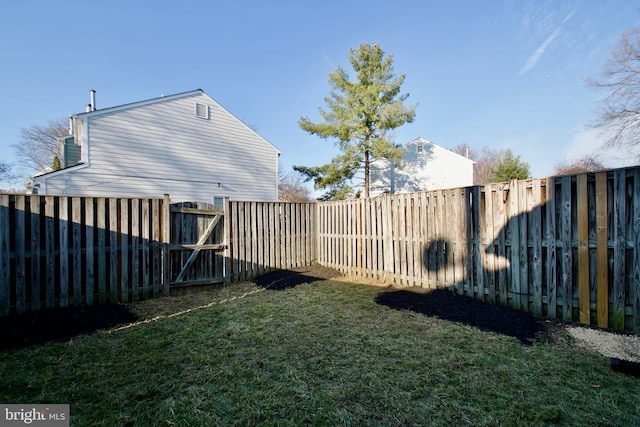 view of yard with a fenced backyard