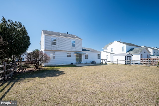 rear view of house with a yard, cooling unit, a fenced backyard, and a patio area