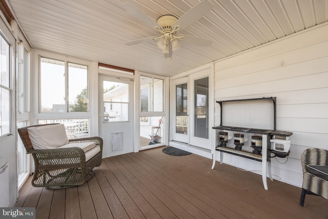 sunroom with a ceiling fan