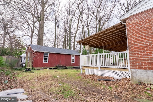 view of side of home featuring an outdoor structure