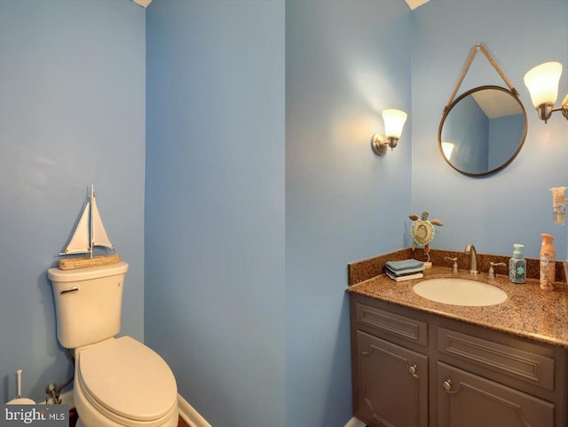 bathroom with toilet and vanity