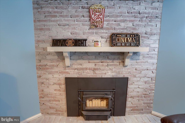 interior details featuring baseboards and wood finished floors