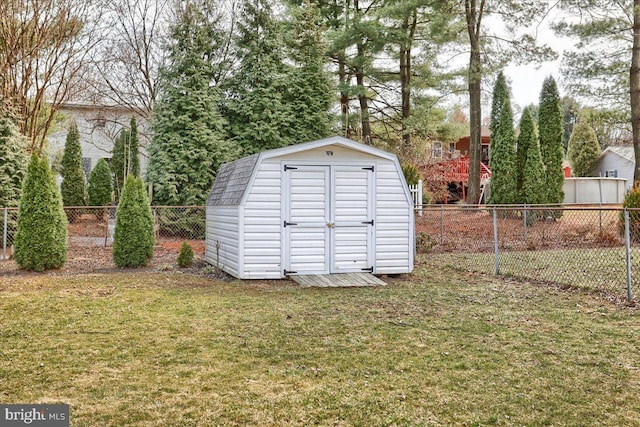 view of shed with a fenced backyard