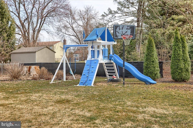 community play area featuring a lawn and fence