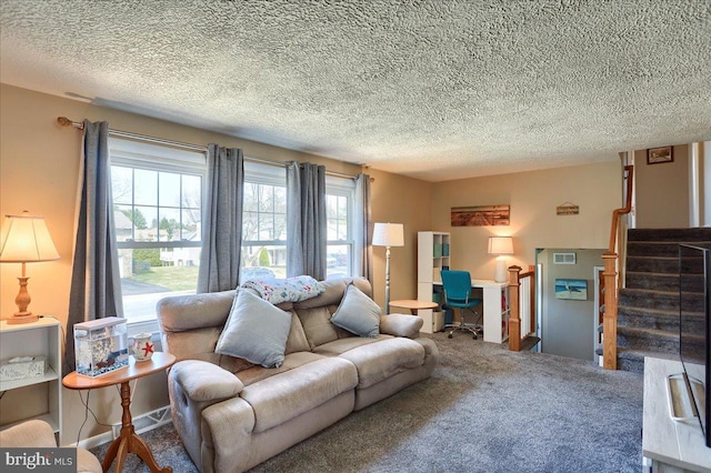 living area with stairway, carpet, visible vents, and a textured ceiling