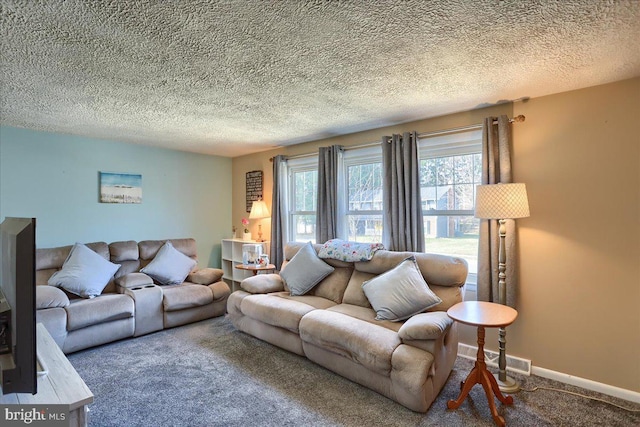 carpeted living area with visible vents, a textured ceiling, and baseboards