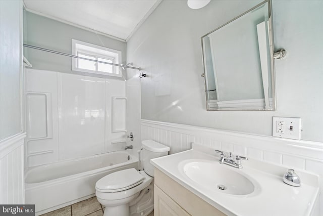 bathroom featuring shower / bath combination, vanity, toilet, and wainscoting