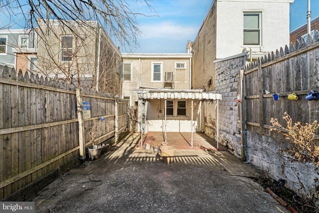 exterior space featuring stucco siding, a patio, and a fenced backyard