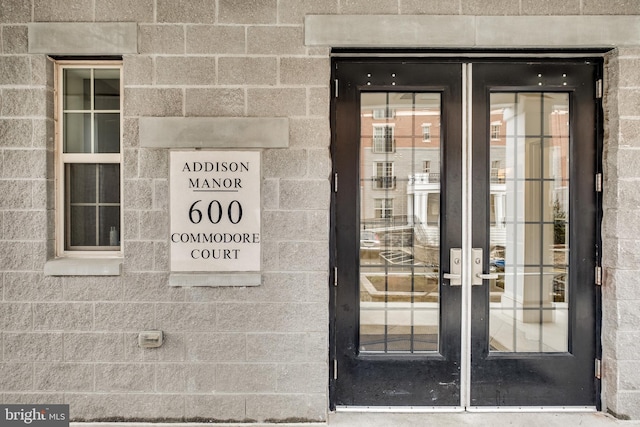 view of exterior entry featuring french doors