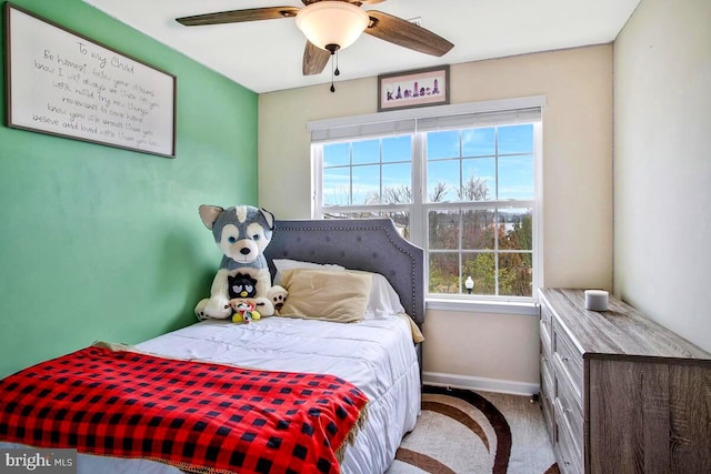 bedroom featuring carpet flooring, a ceiling fan, and baseboards