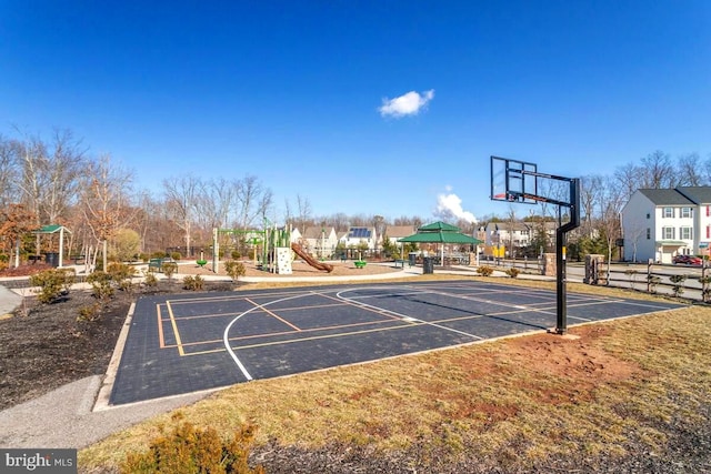 view of sport court with community basketball court and playground community