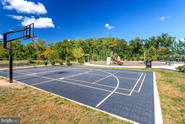 view of sport court featuring community basketball court and playground community