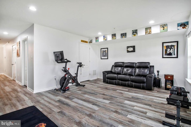 workout area with visible vents, recessed lighting, wood finished floors, and baseboards