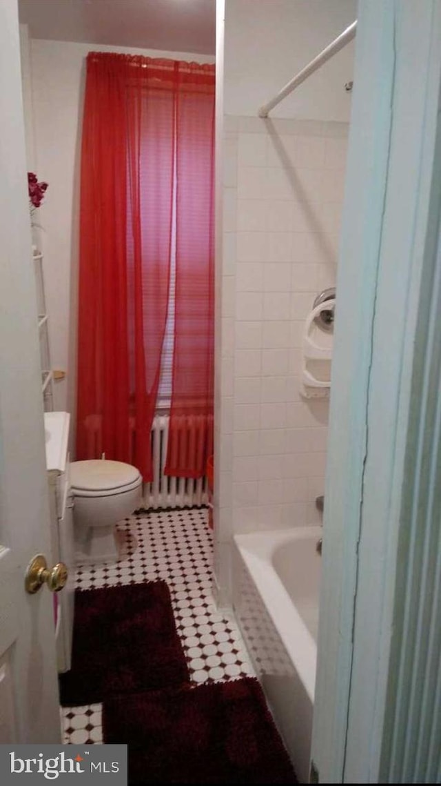 full bathroom with tile patterned floors, toilet, and shower / tub combination