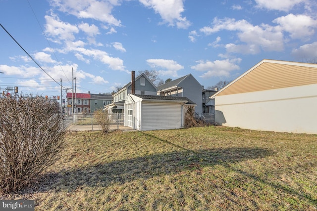 exterior space featuring an outdoor structure, a storage unit, and fence