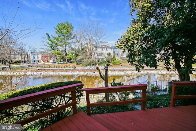 wooden terrace with a water view