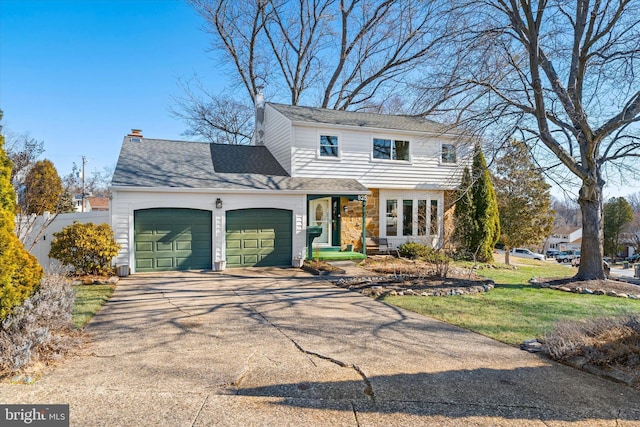 traditional home featuring a front lawn, concrete driveway, a shingled roof, a garage, and a chimney