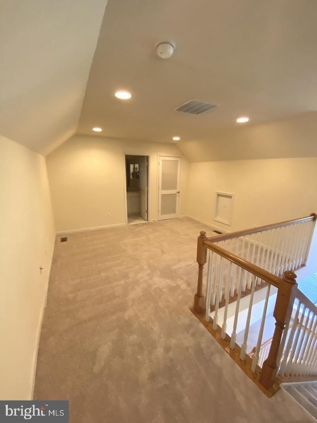 interior space featuring recessed lighting, visible vents, carpet floors, and baseboards