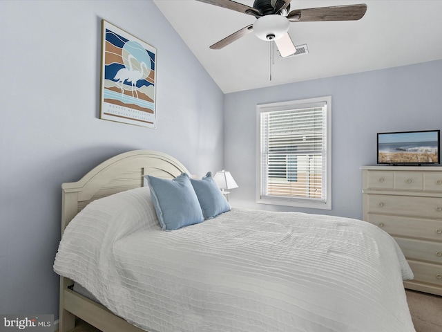 bedroom featuring visible vents, a ceiling fan, and vaulted ceiling