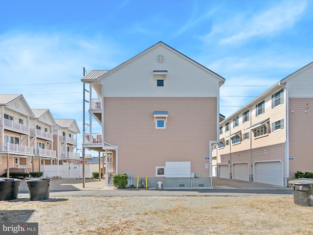 rear view of property with an attached garage