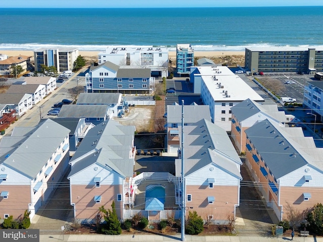 birds eye view of property featuring a residential view, a view of the beach, and a water view