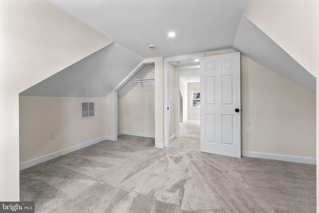 bonus room featuring visible vents, baseboards, carpet floors, and vaulted ceiling