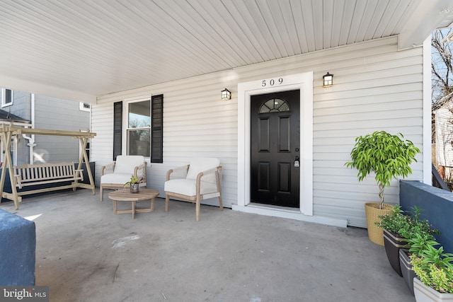 doorway to property with a porch