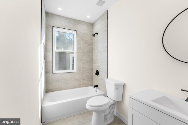 bathroom featuring vanity, baseboards, visible vents, shower / bathing tub combination, and toilet