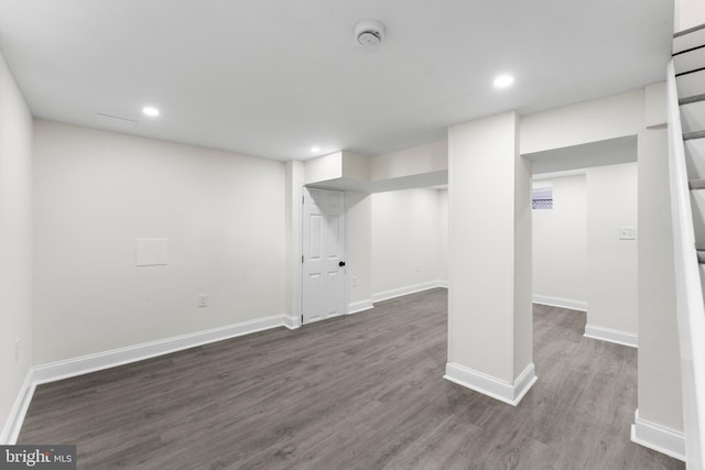 finished basement with recessed lighting, baseboards, and wood finished floors