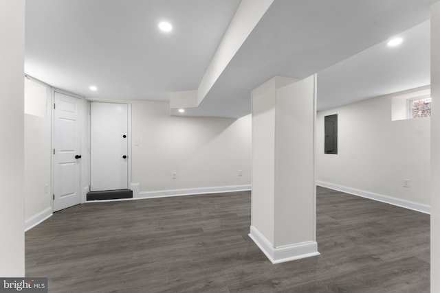 finished below grade area with electric panel, baseboards, and recessed lighting