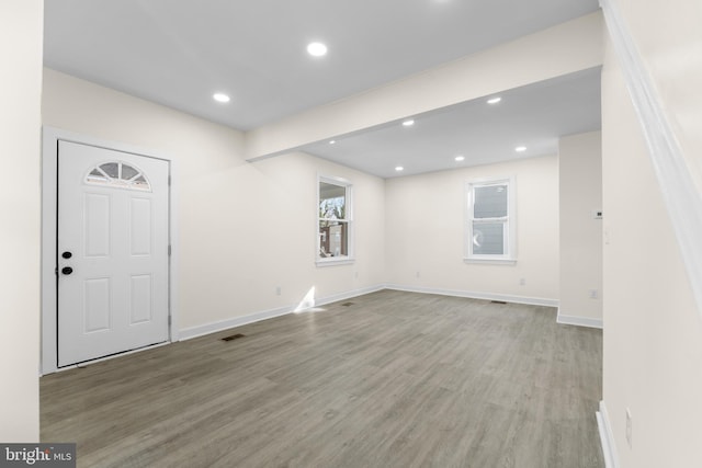 interior space with recessed lighting, visible vents, light wood finished floors, and baseboards