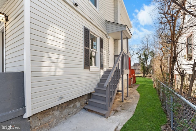 view of side of home with fence