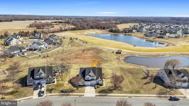 aerial view featuring a residential view and a water view