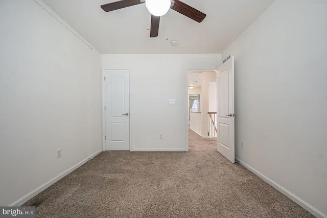 unfurnished bedroom with ceiling fan, baseboards, and carpet