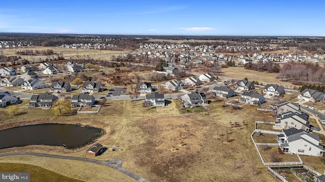 bird's eye view featuring a residential view and a water view