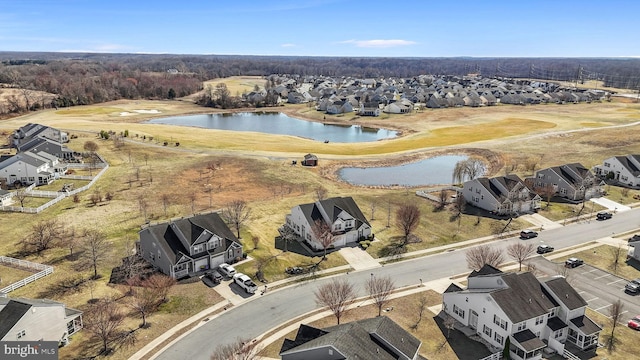 drone / aerial view with a residential view and a water view