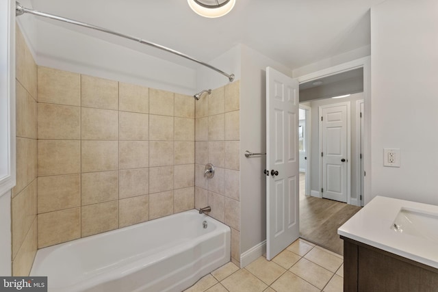 bathroom with tile patterned flooring, vanity, and tub / shower combination