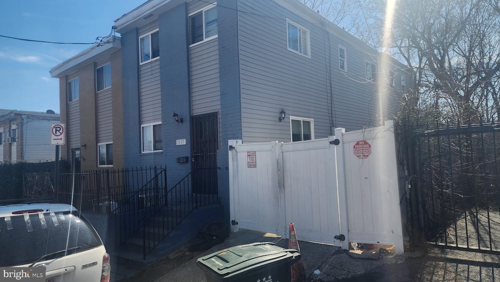 view of home's exterior featuring fence