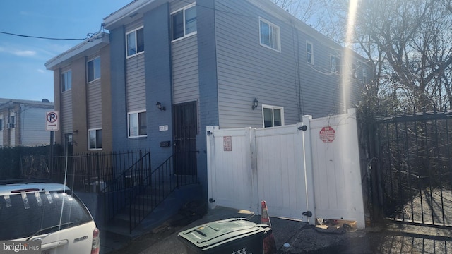 view of home's exterior featuring fence