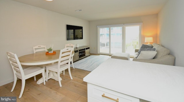 dining room featuring light wood-style floors