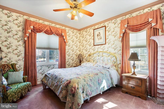 bedroom with wallpapered walls, crown molding, carpet flooring, and a ceiling fan