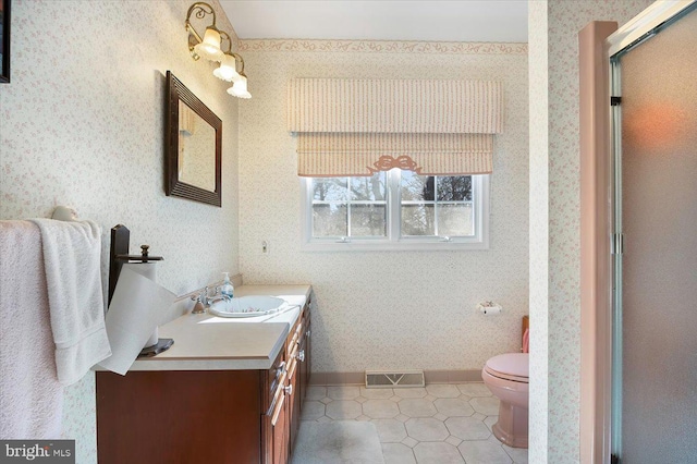 full bathroom with vanity, visible vents, baseboards, wallpapered walls, and toilet