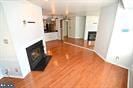 unfurnished living room featuring wood finished floors and a fireplace