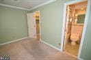 unfurnished bedroom with crown molding