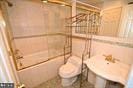 full bathroom featuring toilet and washtub / shower combination