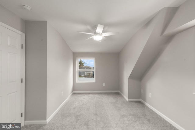 bonus room with baseboards, carpet floors, and ceiling fan