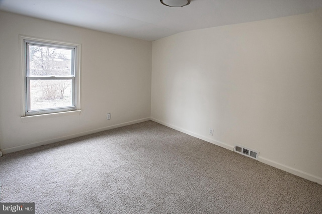 unfurnished room featuring visible vents, baseboards, and carpet floors