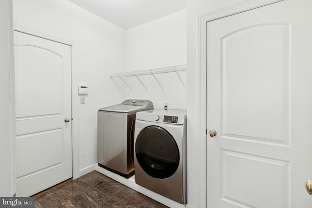 washroom with laundry area and washing machine and clothes dryer